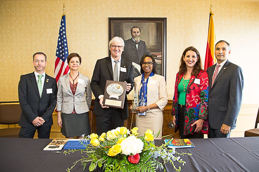 Directors of Economic Development and International Relations for each city stand with Mayors